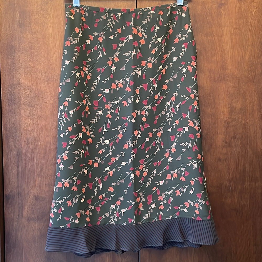 Harold’s olive green flowered skirt w/ ruffle hem